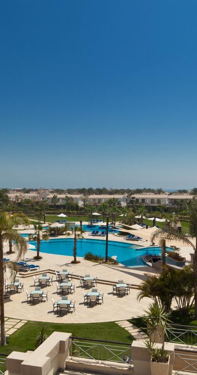 Jaz Little Venice Golf Resort Айн Сохна Екстериор снимка View of the pool at the Al Hamra Golf Club
